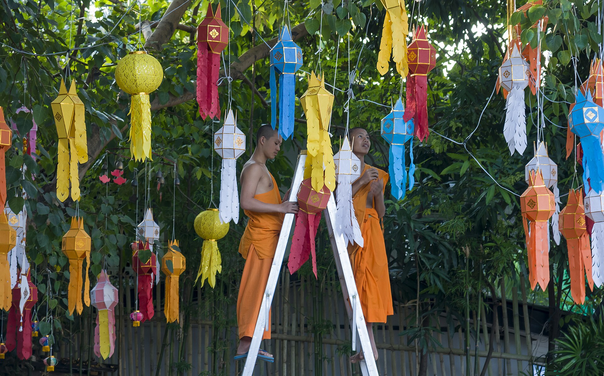A Thai Buddhist monk in saffron robes at a temple in Thailand